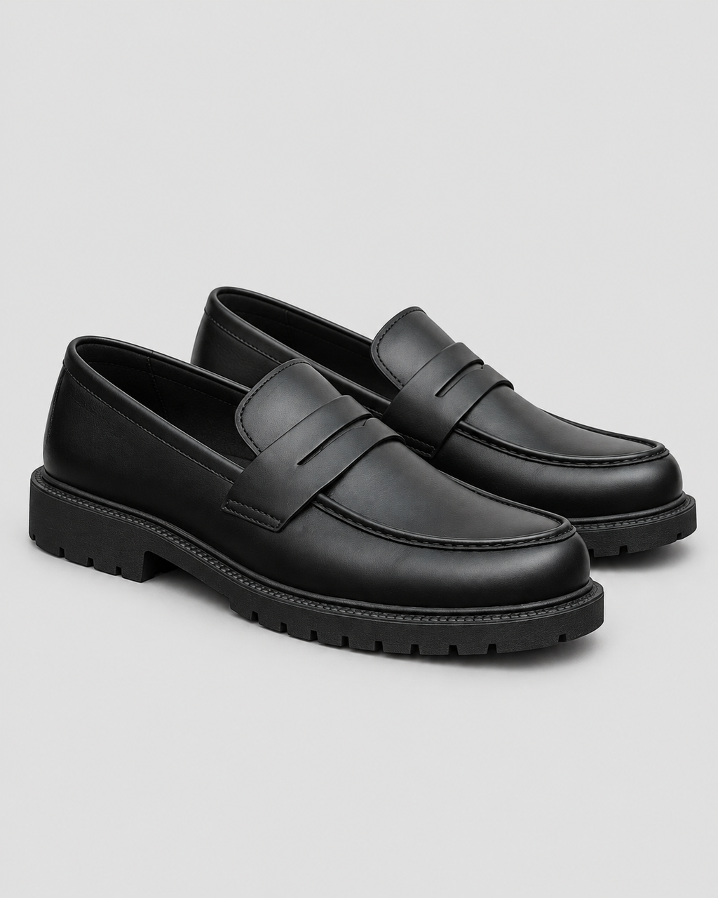Black High Sole Strap Loafer — studio light grey background