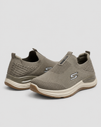 Olive Comfort Knit Slip-On Skechers — studio light grey background