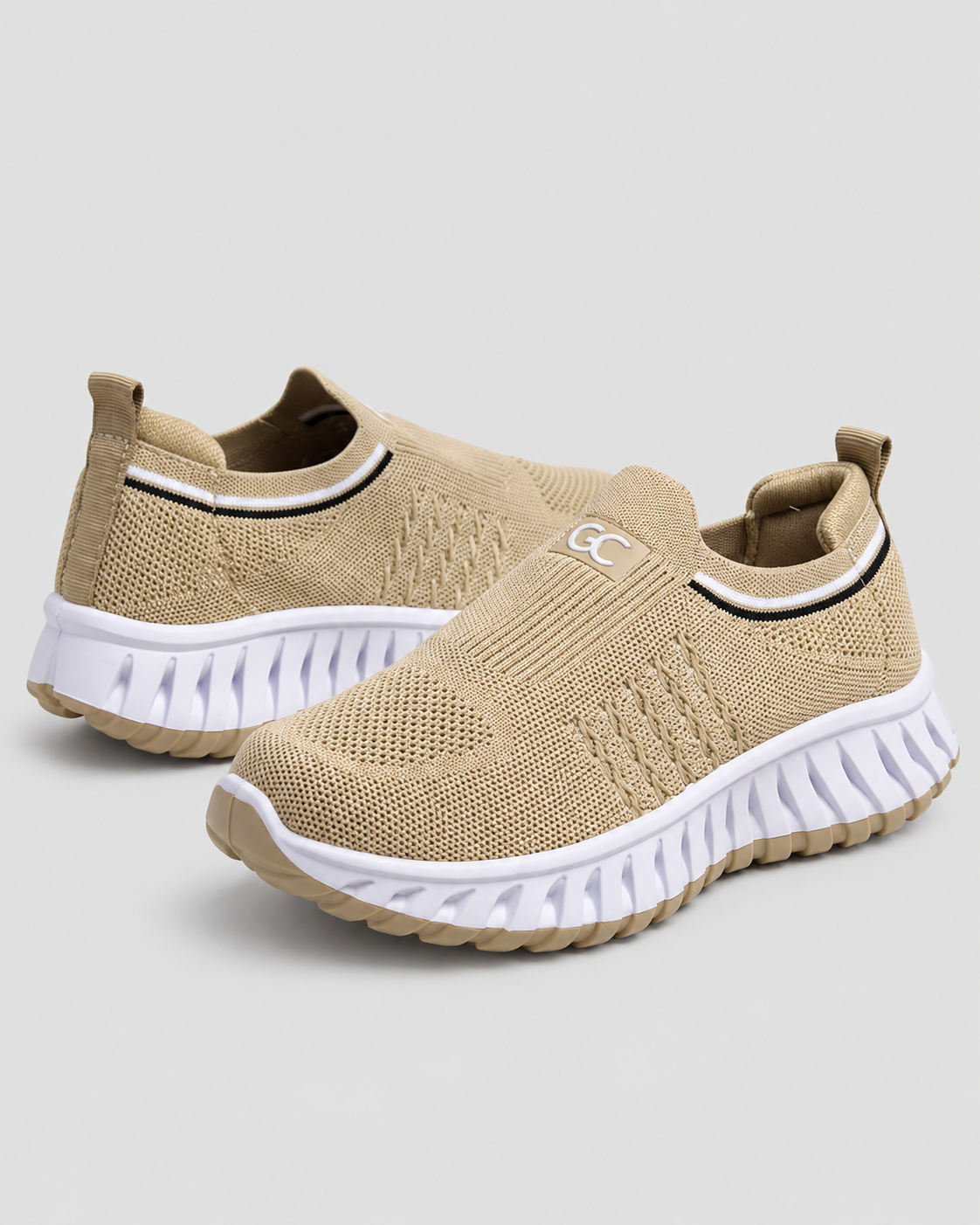 Women’s Knit Comfort Beige Slip-On Sneakers — studio light grey background