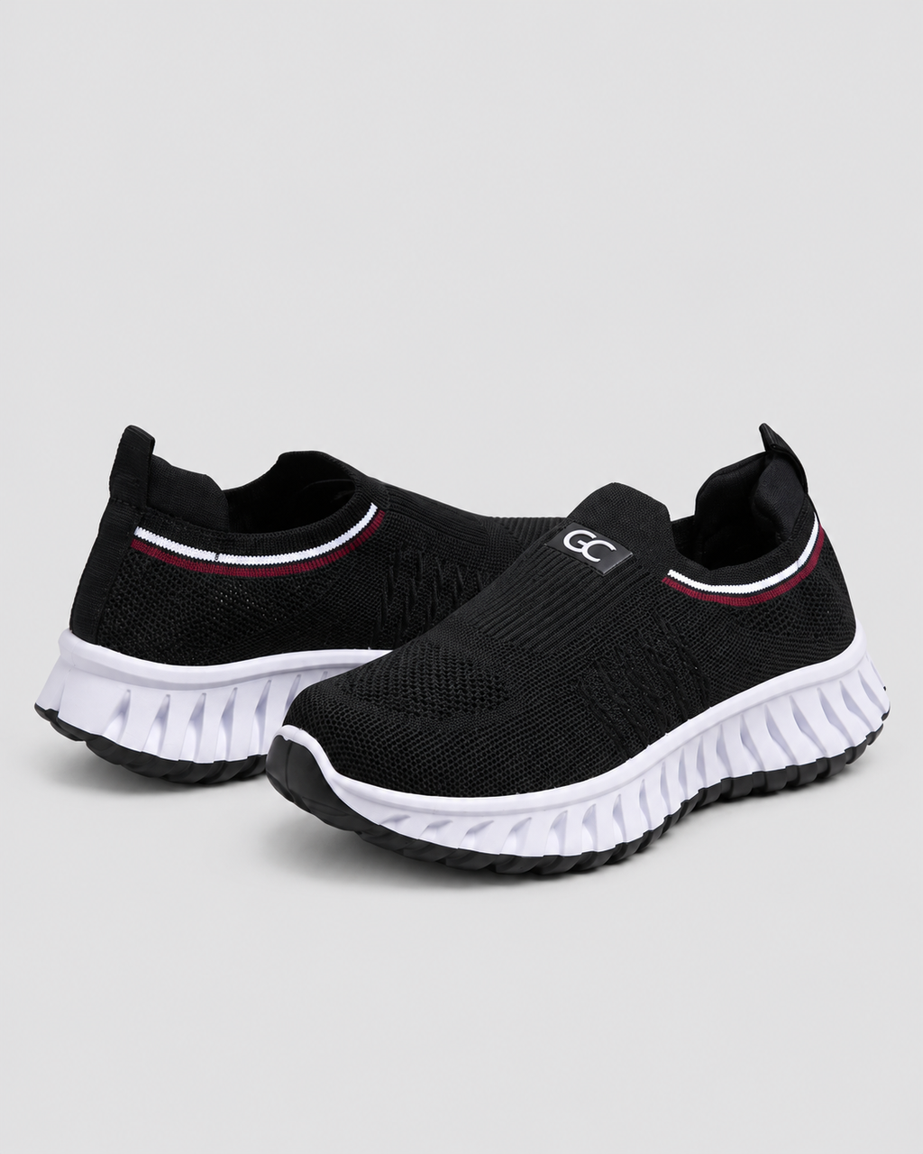 Women’s Knit Comfort Black Slip-On Sneakers — studio light grey background